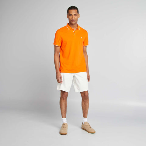 Polo uni en piqué de coton manches courtes