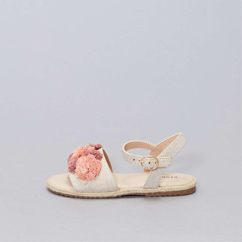 Sandales plates avec pompons sur brides