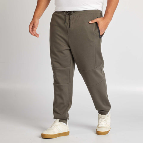 Jogging en maille piquée avec poches zippées