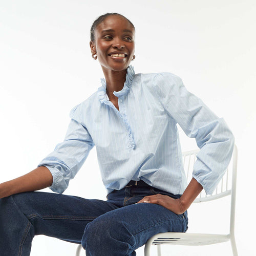 Blouse avec volants au col et à l'ouverture