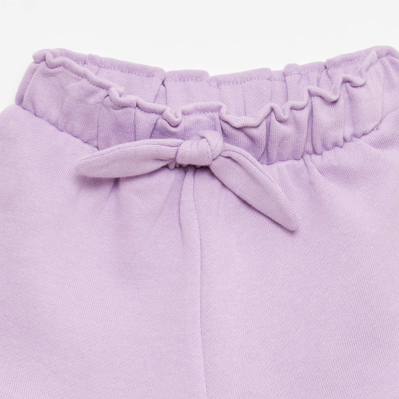 Short volanté avec nœud à la taille