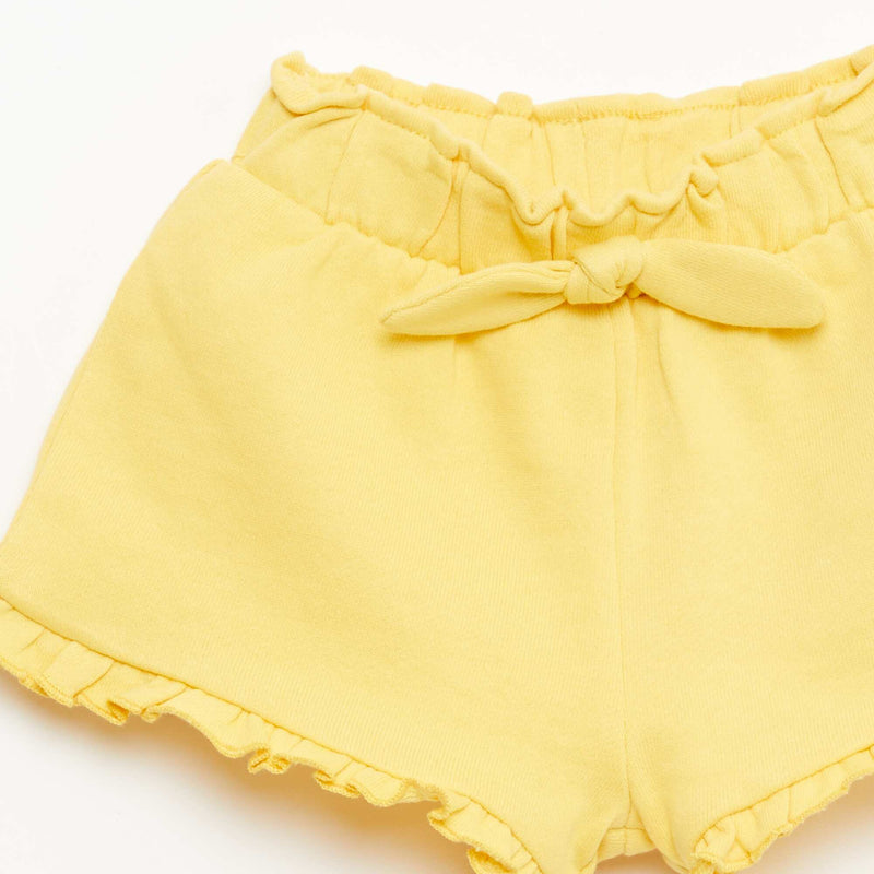 Short volanté avec nœud à la taille