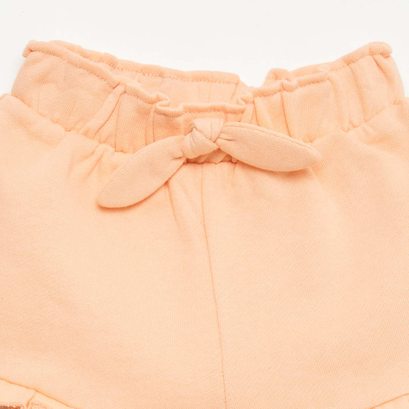 Short volanté avec nœud à la taille