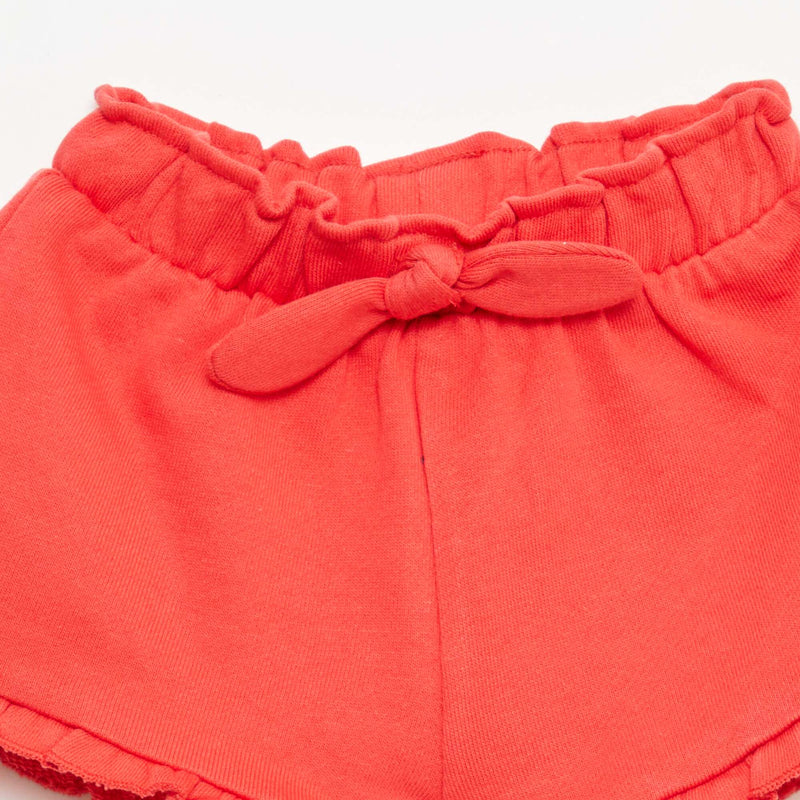 Short volanté avec nœud à la taille