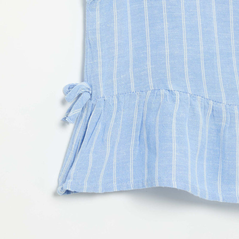 Blouse peplum  avec nœuds fantaisies