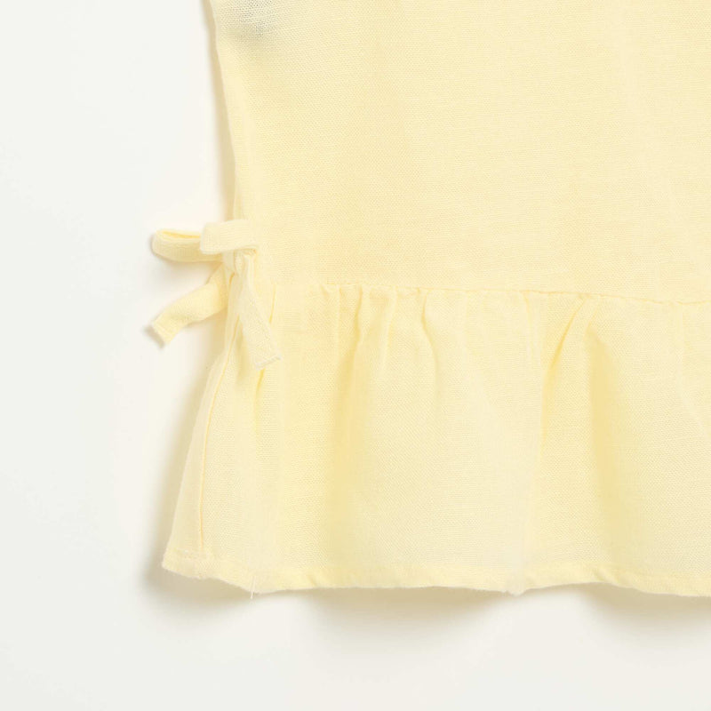 Blouse peplum  avec nœuds fantaisies