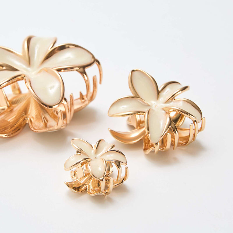 Lot de 3 pinces en fleurs dorées