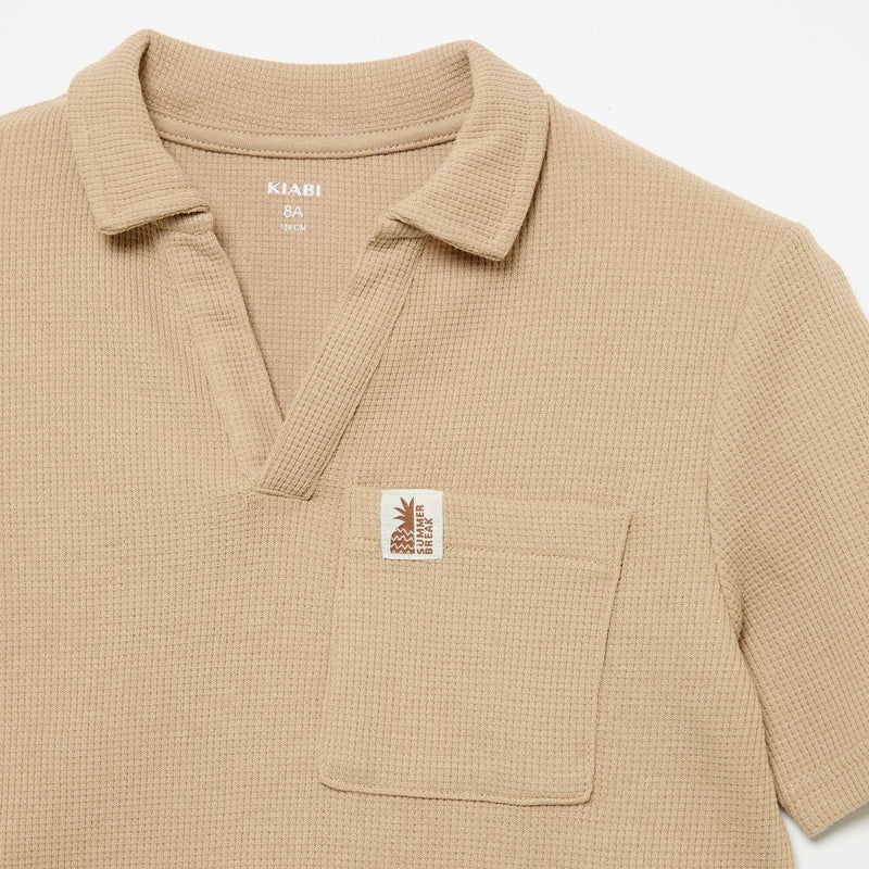 Polo en matière en nid d'abeilles