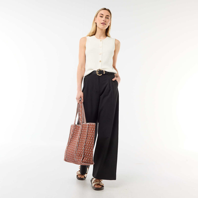 Top sans manches avec boutons dorés