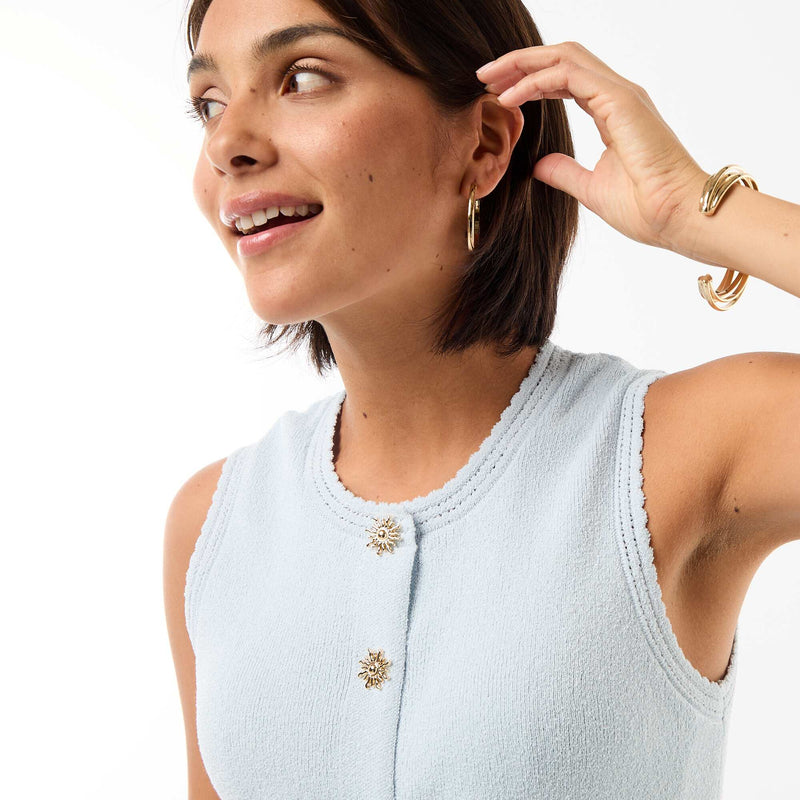 Top sans manches avec boutons dorés